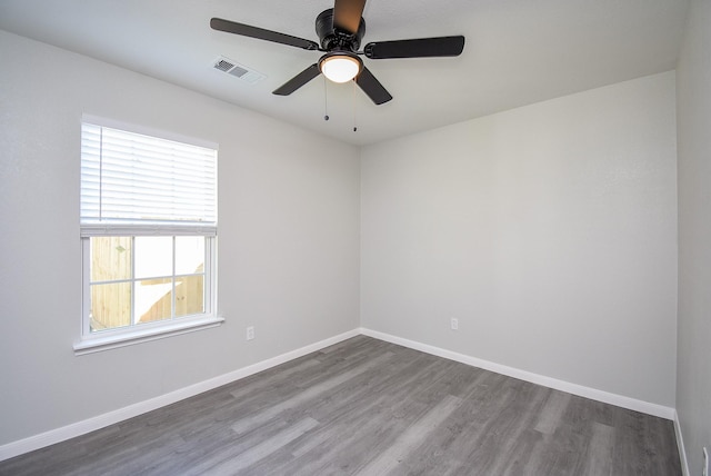 empty room with ceiling fan and wood-type flooring