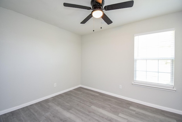 spare room featuring ceiling fan and wood-type flooring