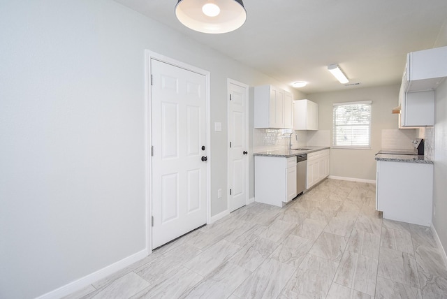 kitchen featuring sink, white cabinetry, dishwasher, light stone counters, and decorative backsplash