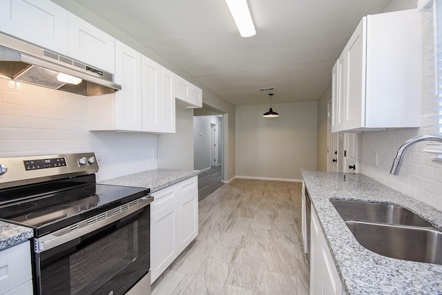 kitchen featuring sink, white cabinets, stainless steel electric range, and light stone counters