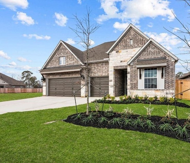 view of front of house featuring a garage and a front lawn