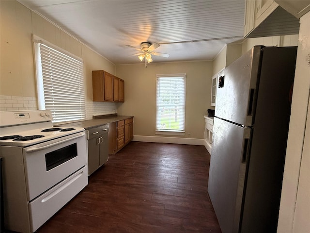 kitchen with dark hardwood / wood-style floors, ceiling fan, white electric range, stainless steel refrigerator, and ornamental molding