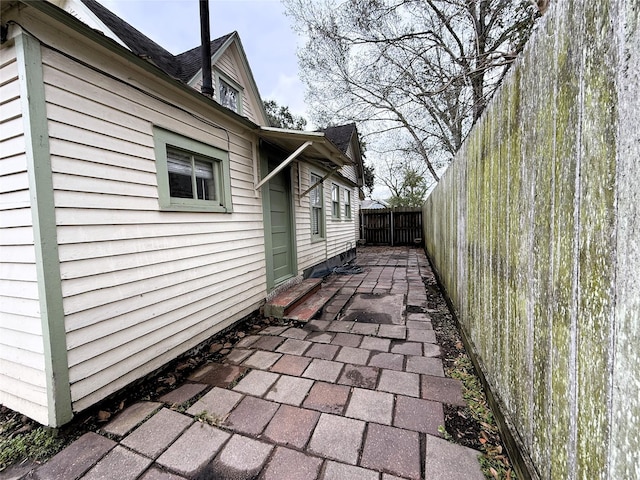 view of property exterior with a patio