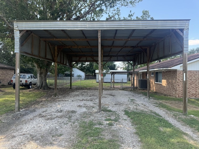 view of vehicle parking with a carport