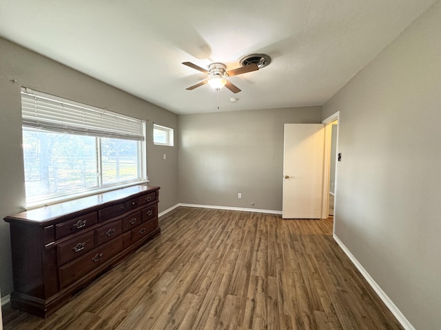 bedroom featuring ceiling fan and dark hardwood / wood-style floors