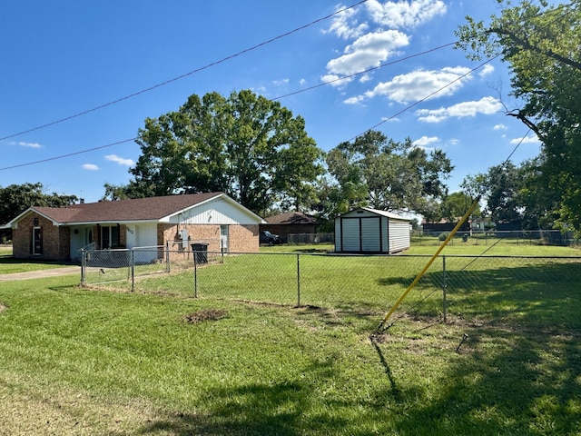 view of yard with a storage unit