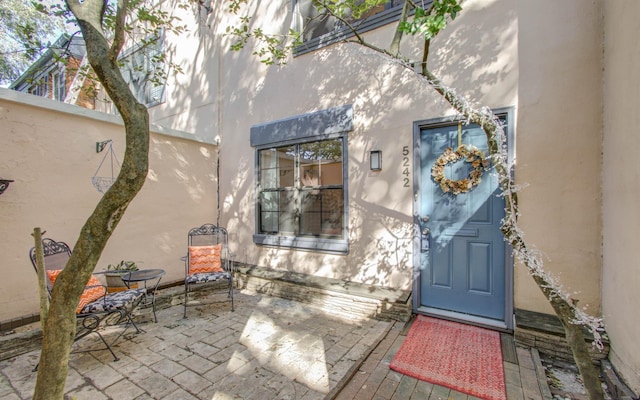 property entrance with a patio