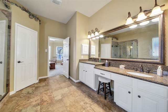 bathroom with vanity and walk in shower