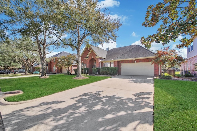 view of front of house with a garage and a front lawn