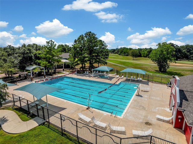 view of swimming pool featuring a patio area