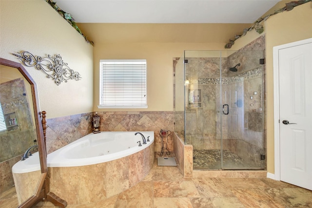 bathroom with shower with separate bathtub