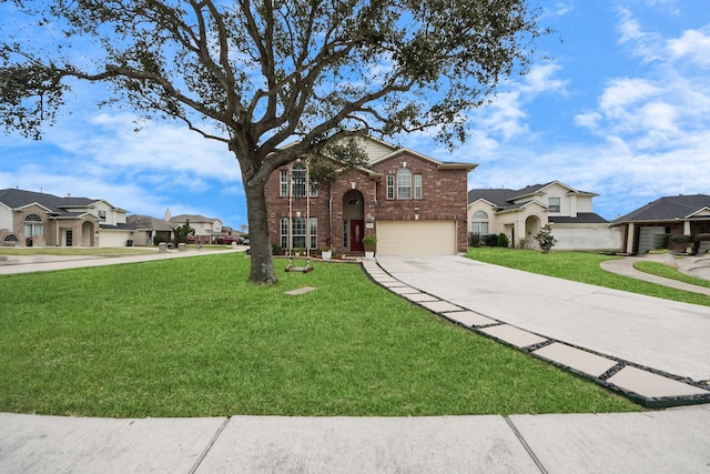 view of front facade with a front yard and a garage