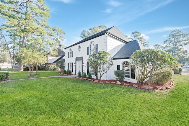 view of home's exterior with a yard