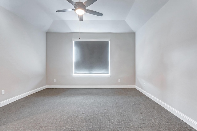 empty room with lofted ceiling and carpet