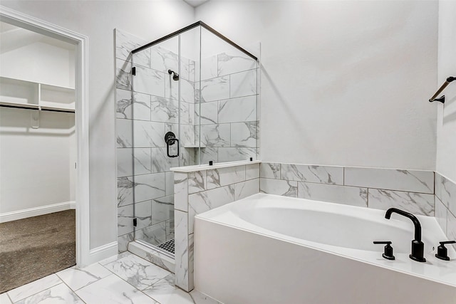 bathroom featuring separate shower and tub