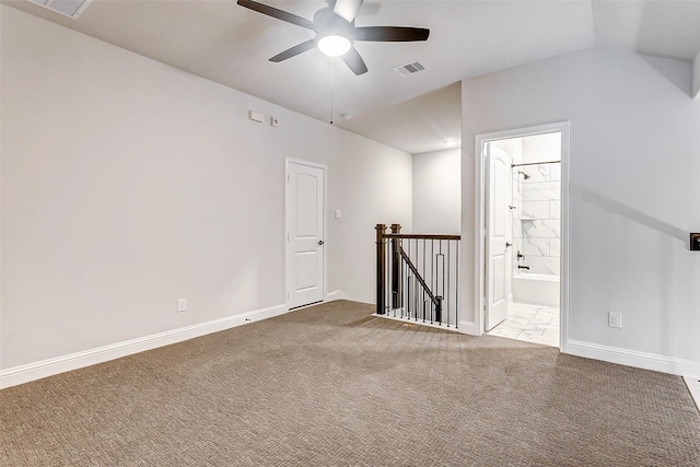 spare room with lofted ceiling, carpet flooring, and ceiling fan