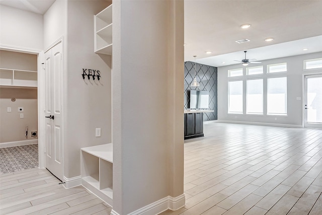 mudroom featuring ceiling fan and light hardwood / wood-style floors