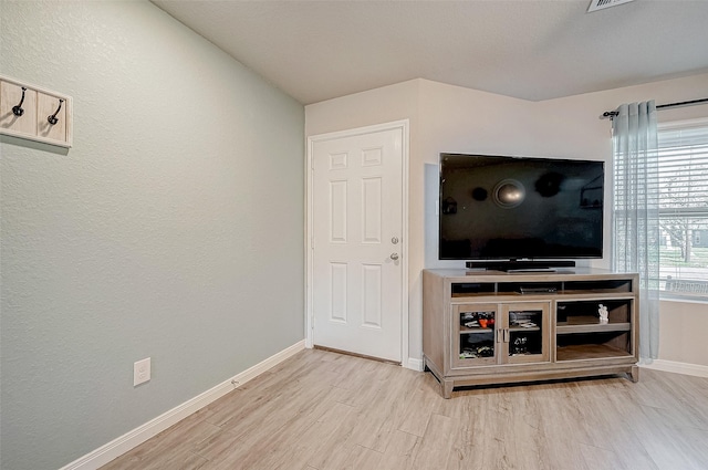 unfurnished living room featuring light hardwood / wood-style flooring