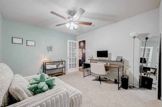 carpeted office with ceiling fan