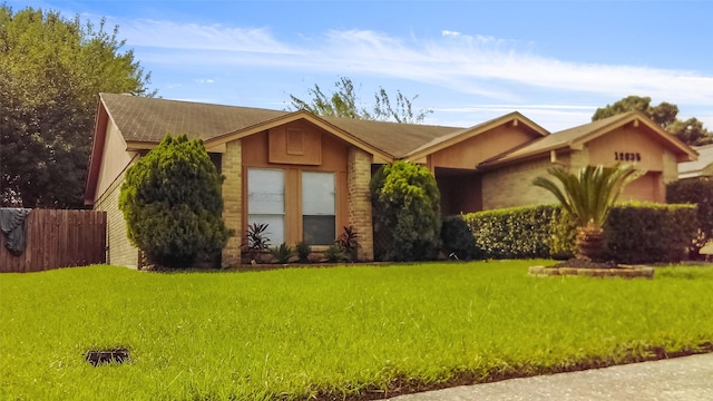 ranch-style house featuring a front lawn