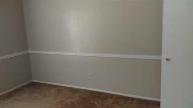 empty room featuring carpet flooring