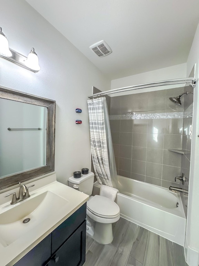 full bathroom with shower / tub combo, toilet, vanity, and wood-type flooring