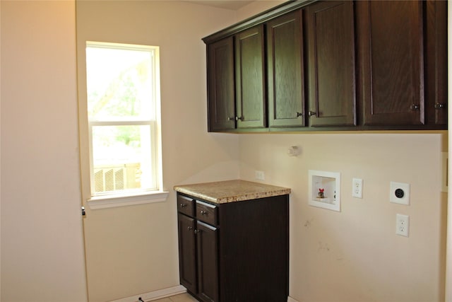 laundry room featuring hookup for a washing machine, hookup for an electric dryer, and cabinet space