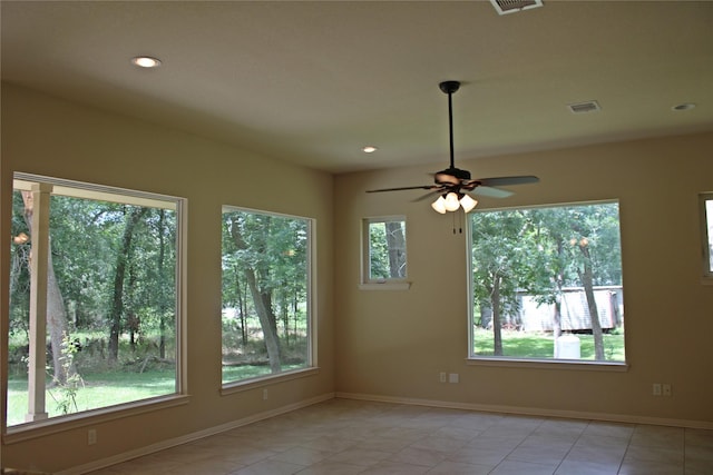 spare room featuring baseboards, visible vents, recessed lighting, and light tile patterned floors