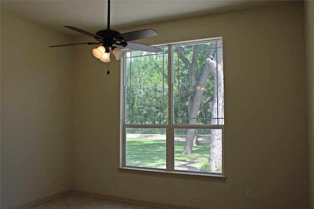 spare room featuring a wealth of natural light and light tile patterned floors