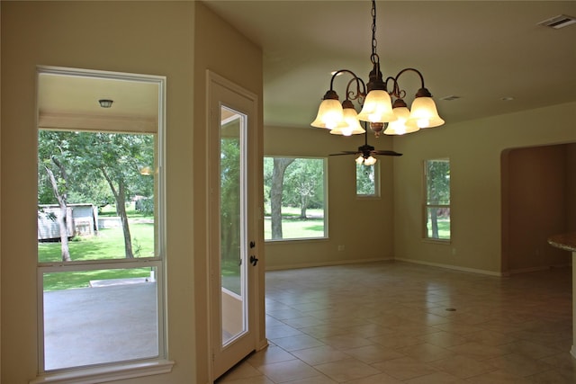 doorway with visible vents, light tile patterned floors, baseboards, and a notable chandelier