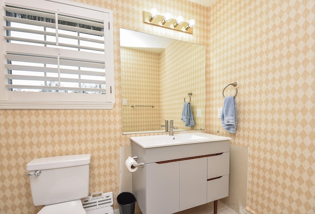 bathroom featuring toilet and vanity