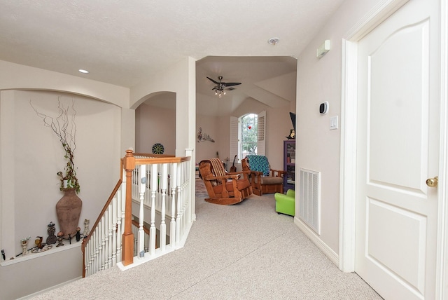 corridor with vaulted ceiling