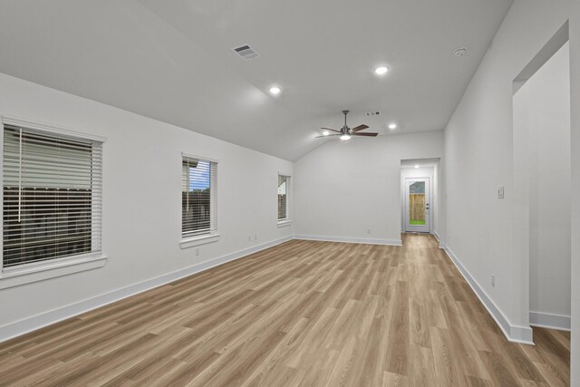 5822 Dawning Sun St, Fulshear, TX 77441 - spare room featuring a ceiling fan, light wood-style floors, vaulted ceiling, baseboards, and recessed lighting