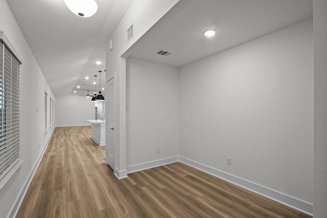 5822 Dawning Sun St, Fulshear, TX 77441 - corridor with wood finished floors, lofted ceiling, recessed lighting, and baseboards