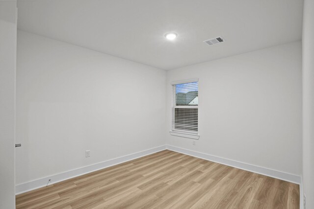 5822 Dawning Sun St, Fulshear, TX 77441 - empty room with light wood finished floors, baseboards, and recessed lighting