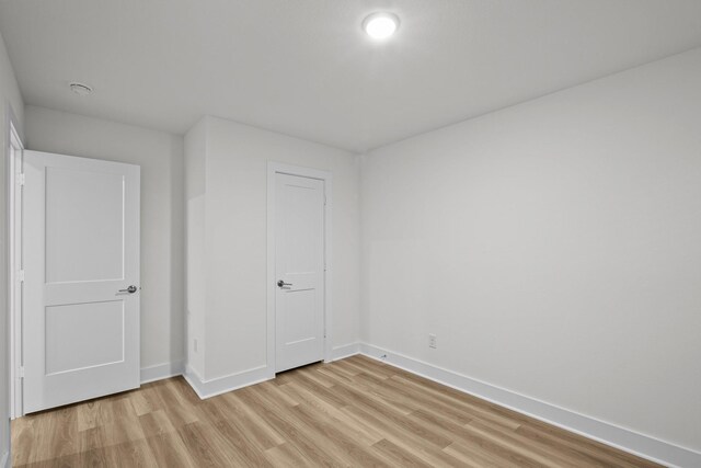 5822 Dawning Sun St, Fulshear, TX 77441 - unfurnished bedroom featuring light wood finished floors and baseboards