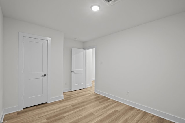 5822 Dawning Sun St, Fulshear, TX 77441 - unfurnished bedroom featuring baseboards and light wood-style flooring