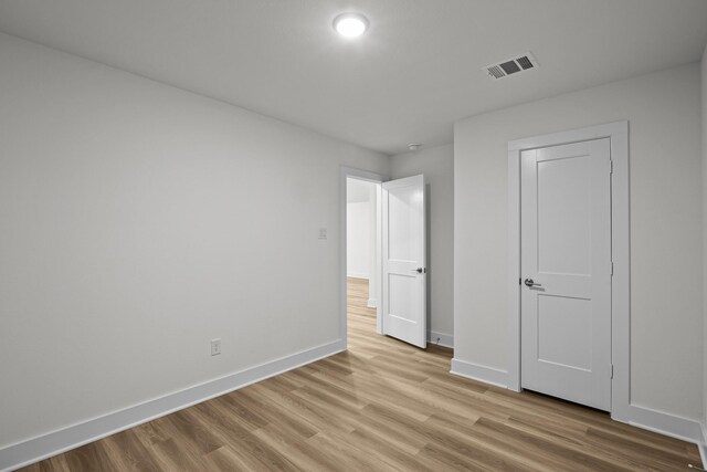 5822 Dawning Sun St, Fulshear, TX 77441 - unfurnished bedroom featuring light wood-style flooring and baseboards