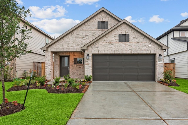 5822 Dawning Sun St, Fulshear, TX 77441 - view of front of property with brick siding, driveway, a front yard, and a garage