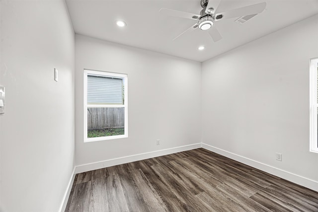 empty room with ceiling fan and hardwood / wood-style floors