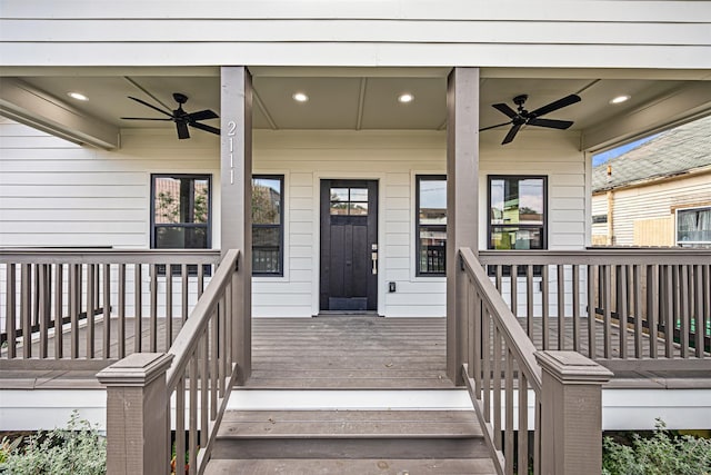 view of exterior entry featuring ceiling fan