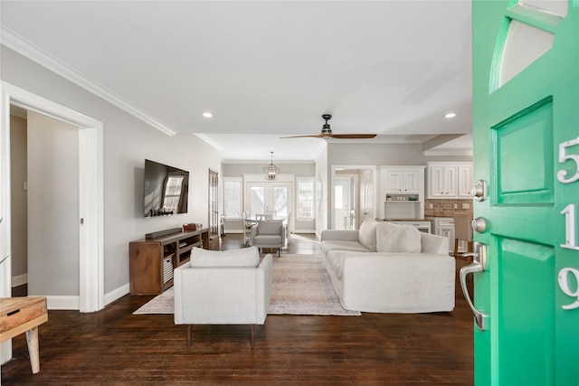 living room with ceiling fan, french doors, and ornamental molding