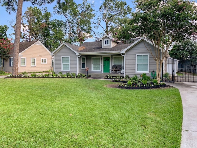 view of front of home featuring a front yard and covered porch