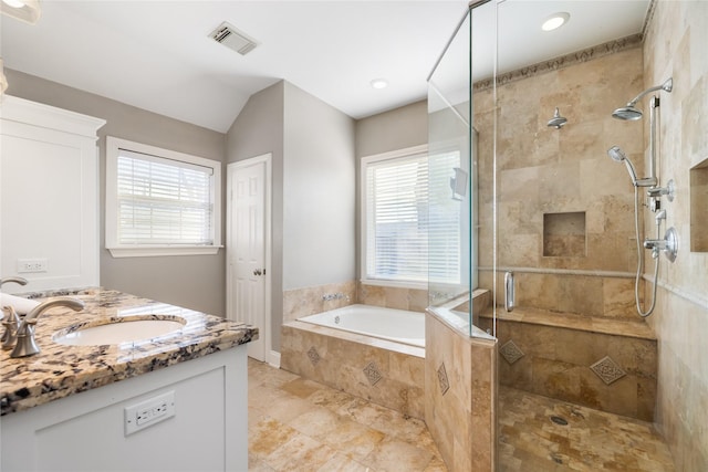 bathroom featuring vaulted ceiling, plus walk in shower, and vanity