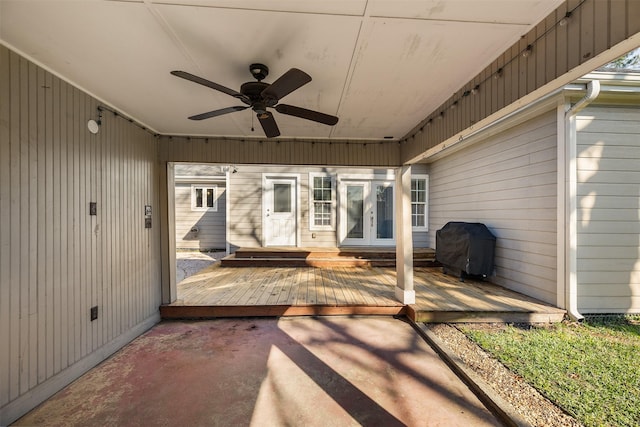 deck with french doors, ceiling fan, and area for grilling