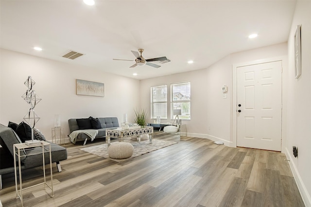 interior space with light wood-type flooring and ceiling fan