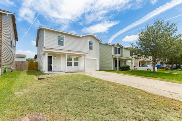 view of front of house featuring a front yard, a garage, and a porch