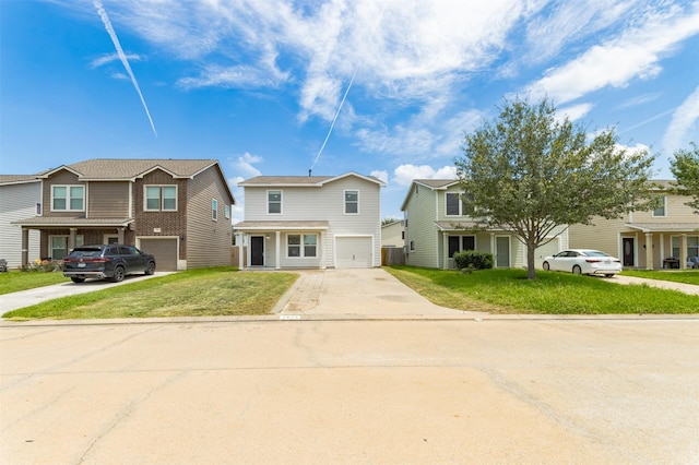 view of front of property featuring a front lawn and a garage