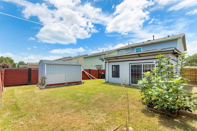 back of property featuring a storage unit and a lawn