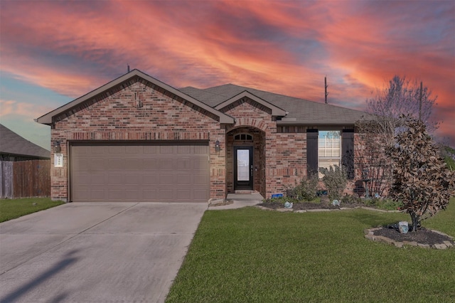 ranch-style house with a yard and a garage